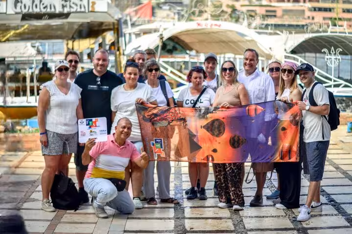 Tour group photo by Nile cruise docks during Cairo full-day customized adventure, with guide and flexible itinerary