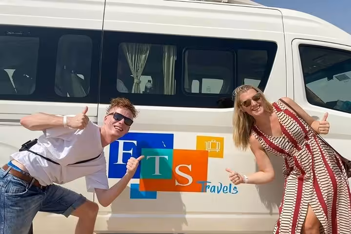 Happy travelers pose by tour van pickup for Cairo full-day customized adventure with private transport and guide