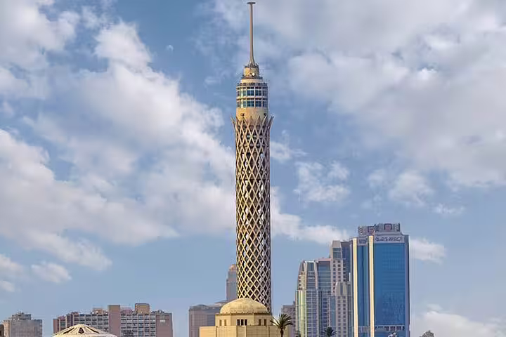 Cairo Tower rising above downtown Cairo skyline, iconic landmark stop on El-Moez Street and El-Fishawy Café tour