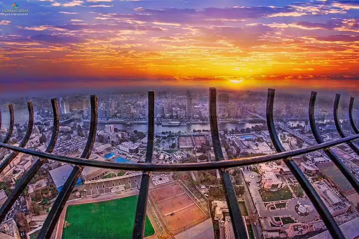 Sunset cityscape from Cairo Tower viewing deck, Nile River panorama on El-Moez Street and El-Fishawy Café tour