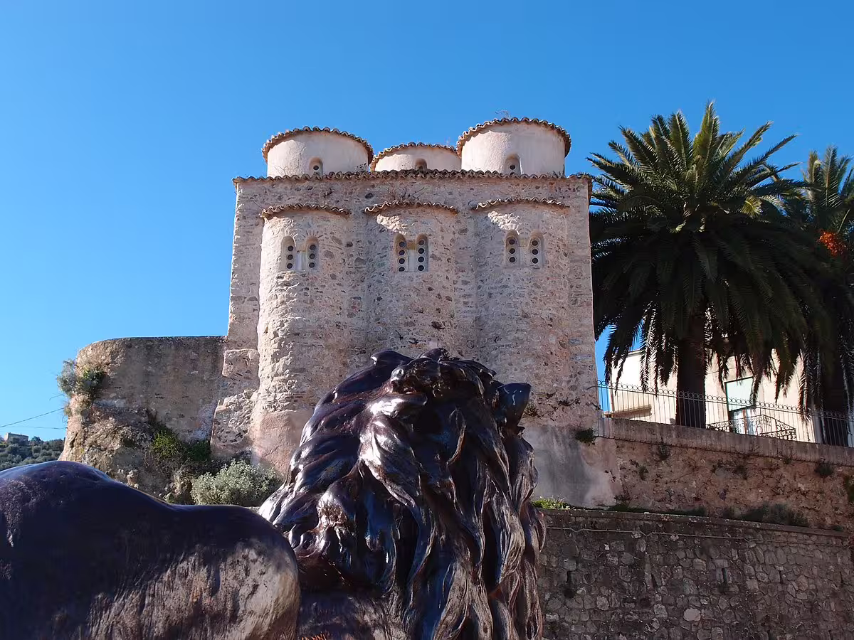 Byzantine Cattolica di Stilo and lion statue under blue sky on Calabria self drive food and culture tour in southern Italy