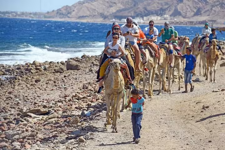 Camel ride along Dahab Red Sea coast after Canyon Salama Jeep safari, combining desert adventure and snorkeling