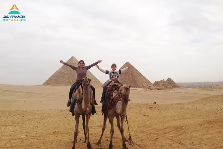 Camel ride near Giza Pyramids in Cairo desert, adventure included in 5 days 4 nights Cairo to Luxor tour
