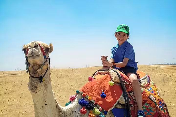 Camel ride in the Giza Desert near the Pyramids on a 2-day private guided Cairo tour with driver