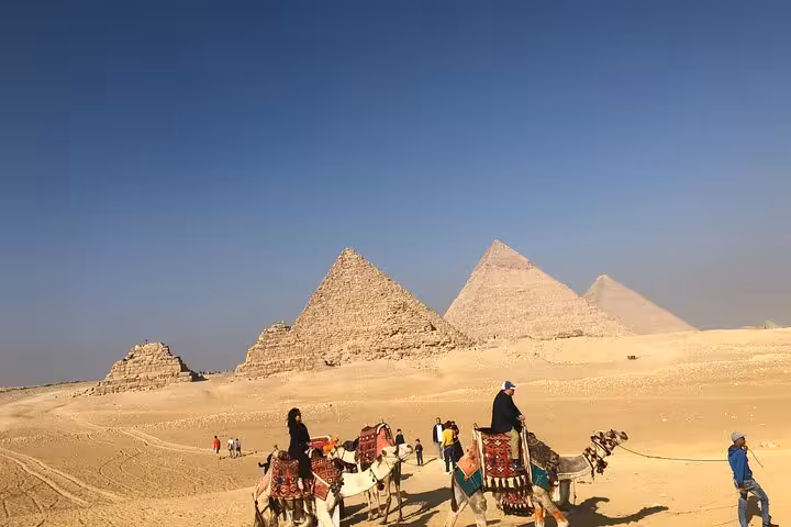 Camel ride across the Giza Plateau with panoramic view of the pyramids on a private tour with lunch included