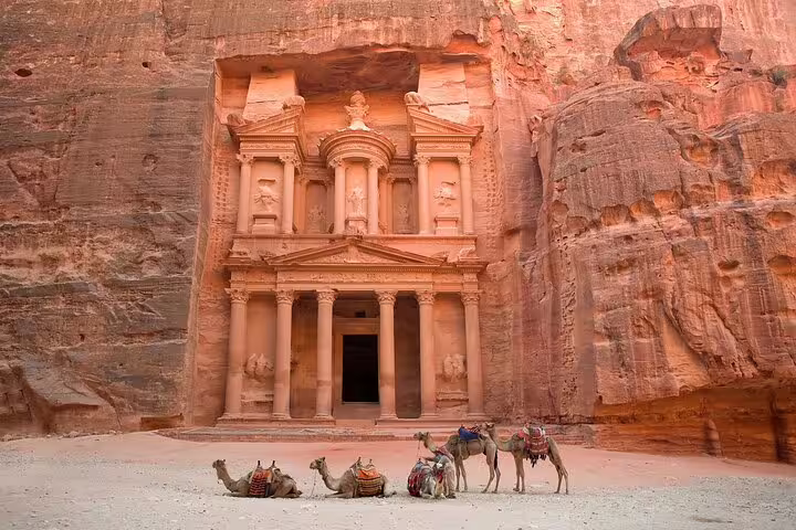 Camels resting before Petra Treasury facade, iconic photo stop on Petra Jordan full-day tour from Sharm El Sheikh