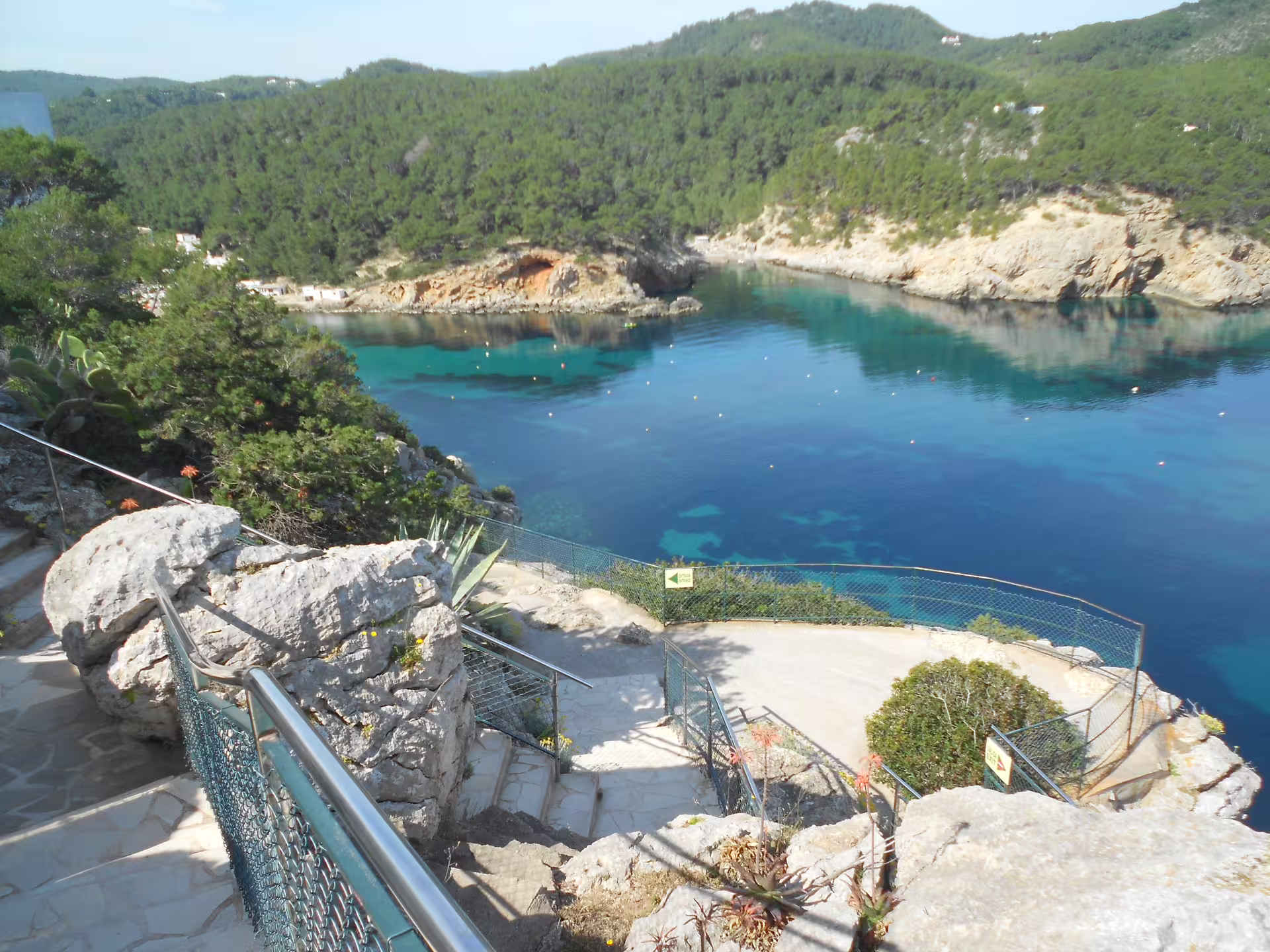 Clifftop path above turquoise bay near Can Marçá Cave, Puerto de San Miguel Ibiza guided tour meeting point