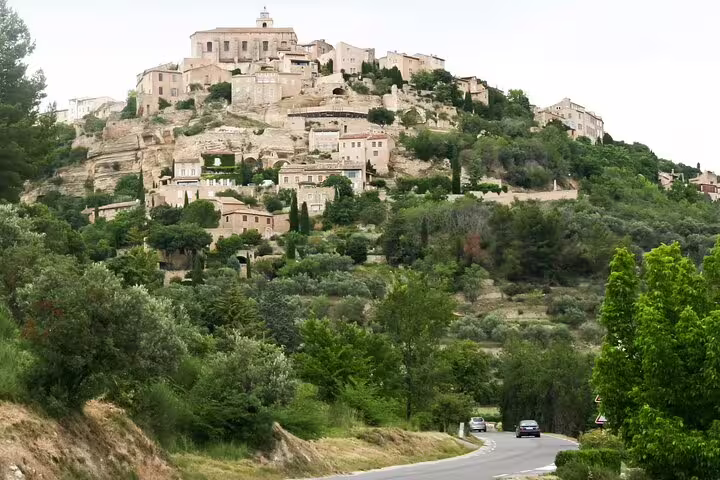 Hilltop stone village in Provence near the Cote d’Azur, scenic road and greenery on a coastal delights tour