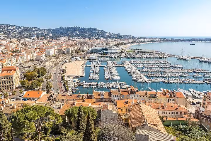 Aerial view of Cannes marina showcasing luxury yachts, ideal for private tours exploring Grasse and perfume factories.