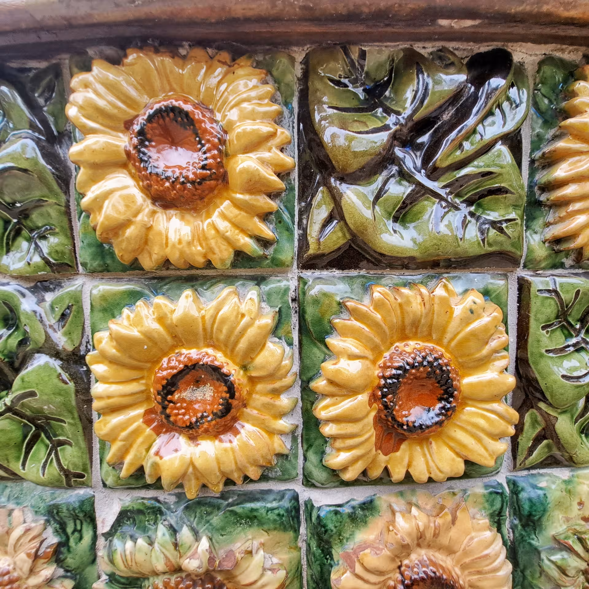 Vibrant ceramic sunflower tiles in Cantabria capturing local artisan craftsmanship on a full-day coastal tour.