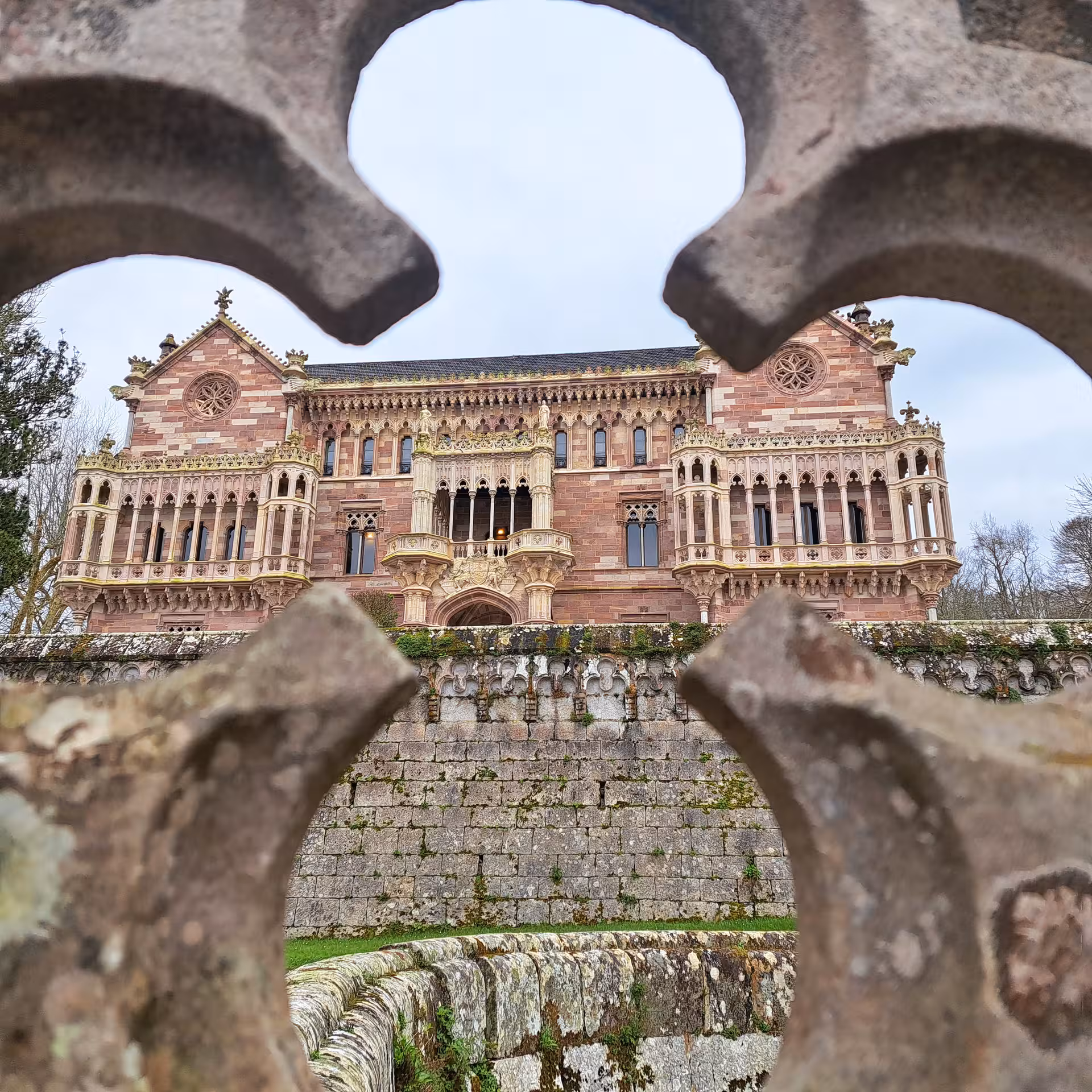Stunning architectural view of a historic Cantabrian mansion framed by ornate stonework on a coastal towns tour.