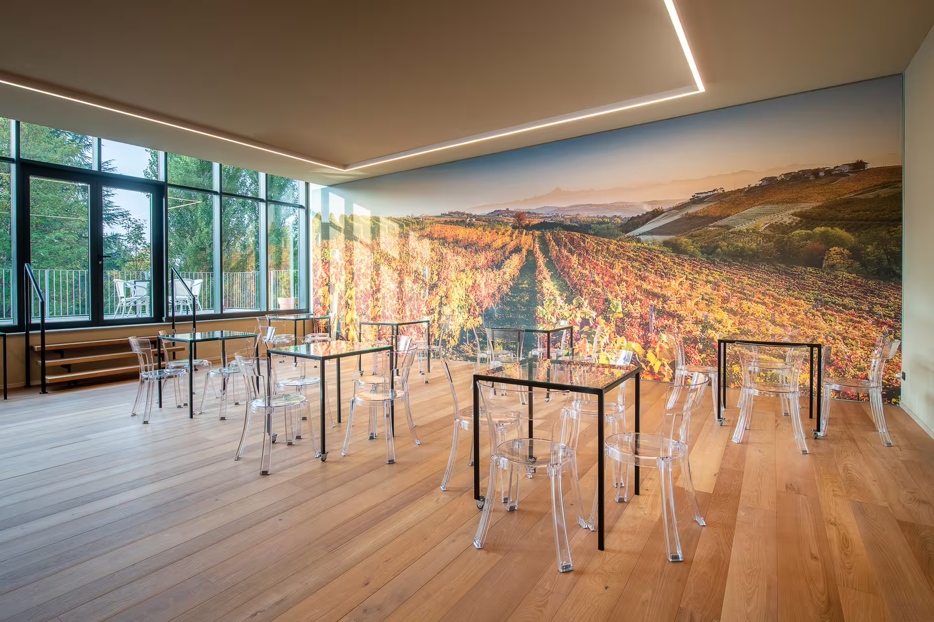 Modern Cantina Moscone tasting room with vineyard mural, set for Langhe wine tasting experience