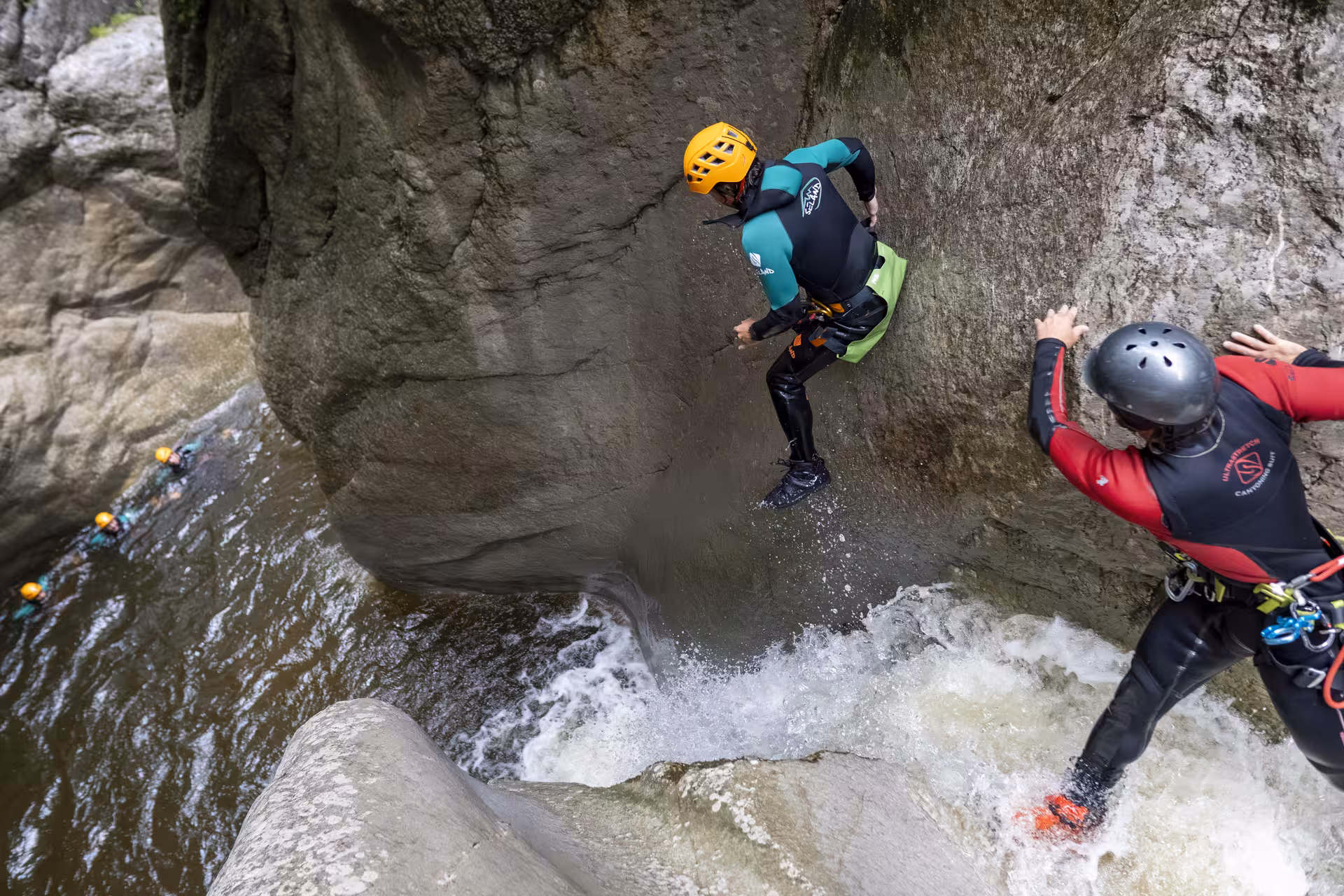 Thrill-seekers jump into water during a canyoning adventure in Chli Schliere, an exciting activity near Luzern.