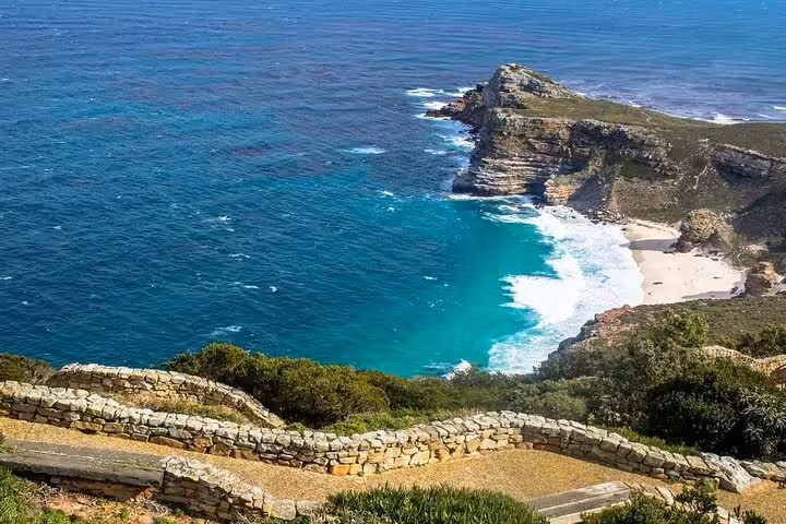 Breathtaking view of Cape of Good Hope's rugged coastline and turquoise waters, perfect for Cape Town adventures.