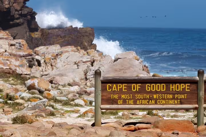 Cape of Good Hope sign with rugged coastline on a Cape Town full-day Cape Peninsula tour, South Africa