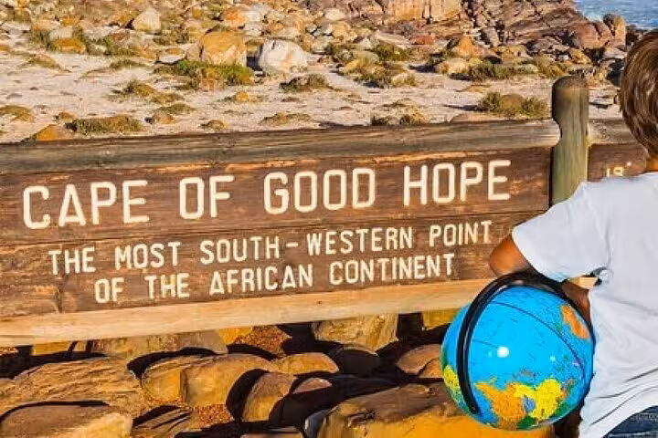 Visitor at Cape of Good Hope sign, the southwestern tip of Africa, during a private tour of Cape Point.