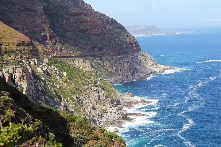 Scenic coastal cliffs of Cape Point with turquoise ocean views, ideal for a private day tour exploring nature's beauty.