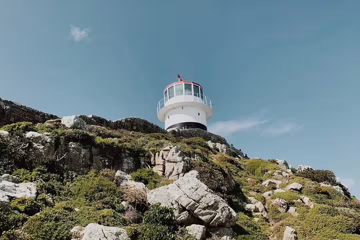 The iconic Cape Point Lighthouse stands atop rugged cliffs, offering stunning views of the Cape Peninsula.