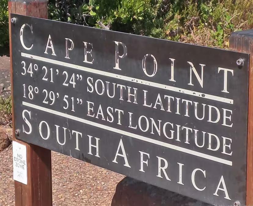Discover Cape Point's iconic signage marking coordinates on a private Cape Town tour highlighting South Africa's beauty.