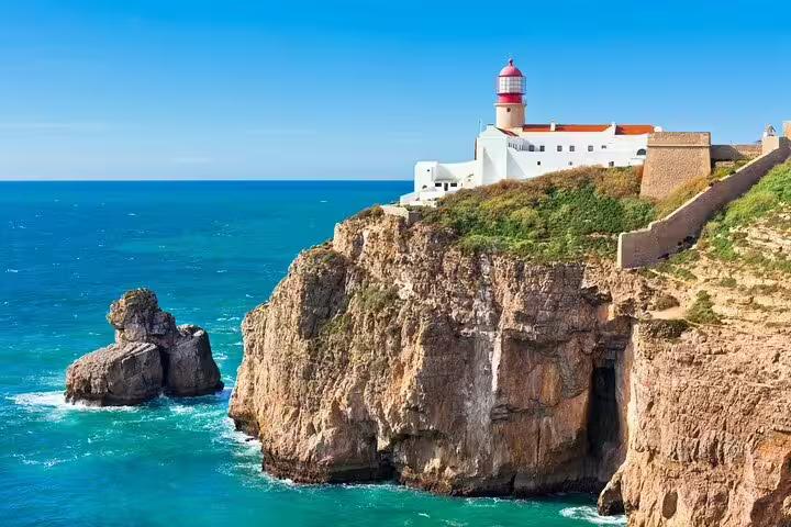 Cape St Vincent lighthouse atop Sagres cliffs, Algarve coast view on Faro to Sagres private scenic tour