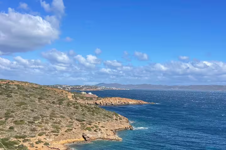 Athenian Riviera coastline near Cape Sounio on a private tour, blue Aegean Sea and rocky cliffs