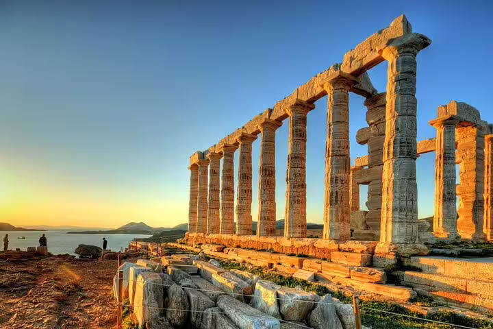 Golden hour view of Temple of Poseidon on Cape Sounio, Athenian Riviera private tour from Athens