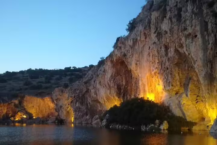 Sunset-lit sea cliffs on the Athens Riviera, scenic stop on a Cape Sounio private tour from Athens