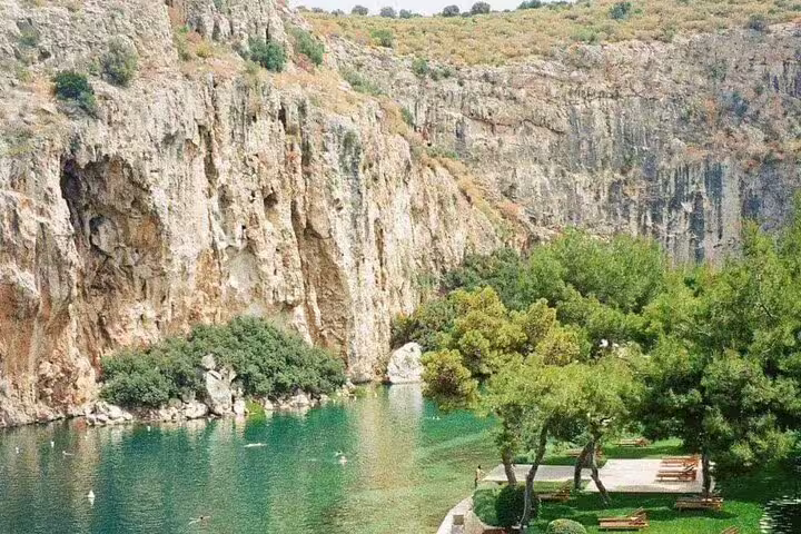 Emerald lagoon beneath limestone cliffs, relaxing nature stop on a Cape Sounio and Temple of Poseidon tour