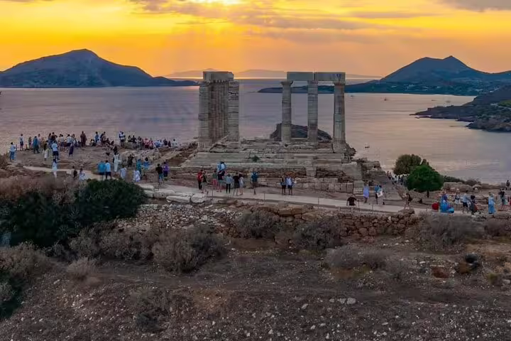 Sunset view of Temple of Poseidon at Cape Sounio on a private tour from Athens, overlooking the Aegean Sea