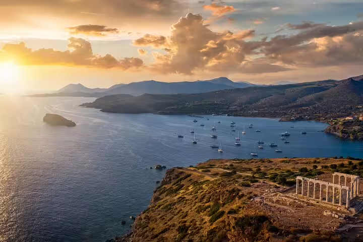 Sunset view over Cape Sounio and Athenian Riviera coastline near the Temple of Poseidon on a private tour
