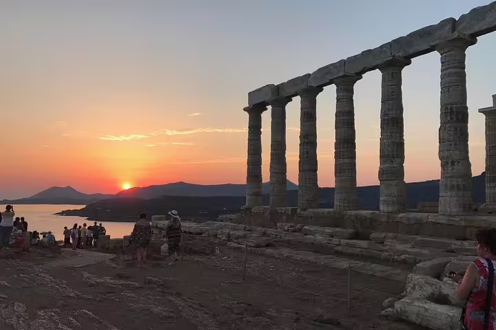 Sunset view from Cape Sounion with Temple of Poseidon columns and Aegean Sea on a guided day tour from Athens