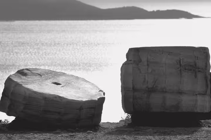 Ancient marble blocks at Cape Sounion with Aegean Sea backdrop on Temple of Poseidon morning tour