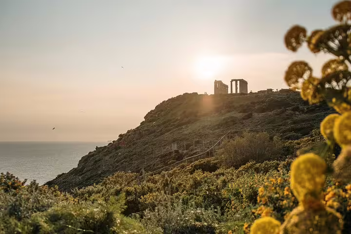 Morning view of Cape Sounion cliffs with Temple of Poseidon ruins, half-day small-group tour from Athens
