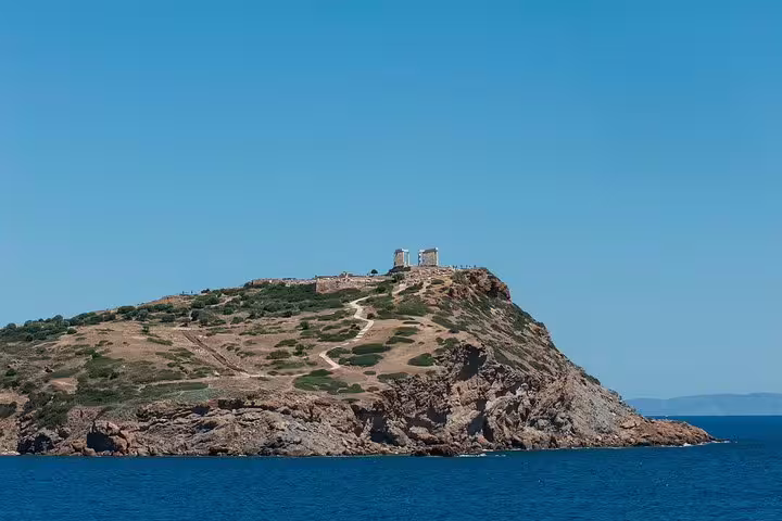 Cape Sounion cliff view with Temple of Poseidon ruins above the Aegean, ideal for a private sunset tour