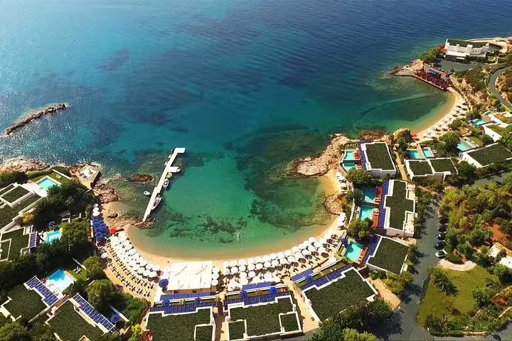 Aerial view of turquoise beach bay near Cape Sounion, ideal stop on a private sunset tour from Athens