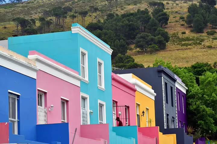 Vibrant, colorful houses of Bo-Kaap in Cape Town with Table Mountain backdrop, ideal for cultural tour exploration.