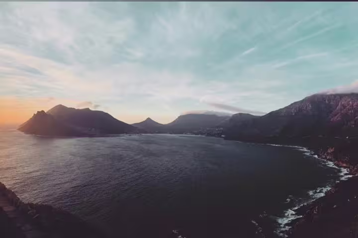 Stunning sunset view from Chapman's Peak Drive highlighting Cape Town's breathtaking coastal scenery.