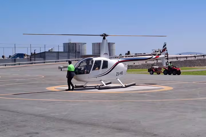 Helicopter on helipad in Cape Town, offering thrilling aerial tours to Hout Bay and the Atlantic Coast.