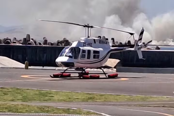 Helicopter on a helipad ready for takeoff, offering tours from Cape Town to the scenic Atlantic Coast and Hout Bay.