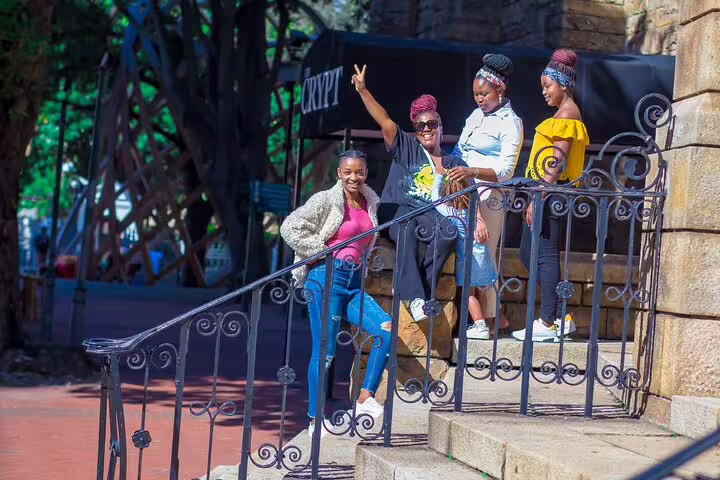Group of tourists enjoying the historic architecture on a guided Cape Town city and Table Mountain half-day tour.