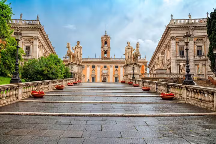 Grand staircase to Piazza del Campidoglio on Capitoline Hill in Rome, lined with statues and palaces on a private tour route