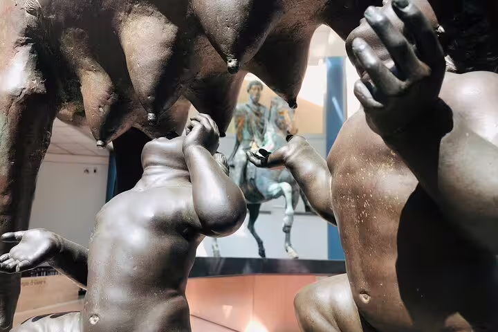 Close-up of Romulus and Remus bronze figures beneath the Capitoline Wolf during a private guided tour of Rome’s Capitoline Museums