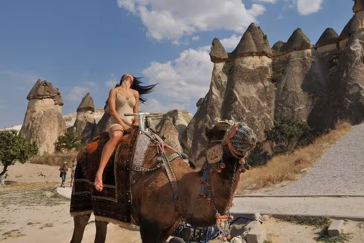 Camel ride in Cappadocia among fairy chimneys on private tour from Istanbul by plane, Goreme Valley views