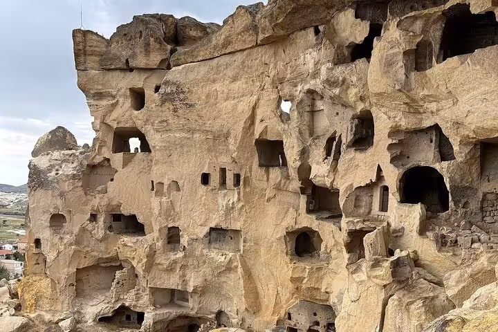 Ancient Cappadocia rock-cut cave dwellings and tunnels, explored on a private tour with lunch in Turkey