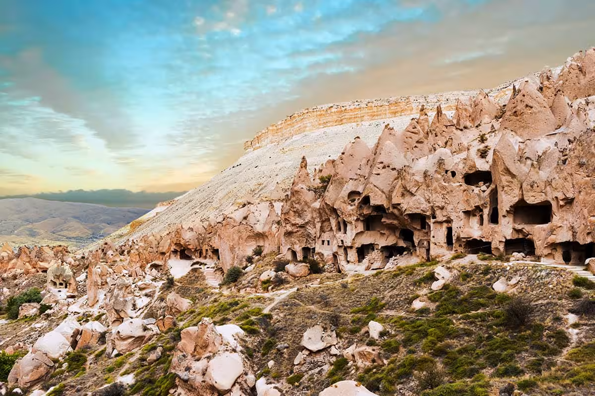 Cappadocia rock-cut cave dwellings and valleys at sunset, included in 5 Days Taste of Turkey package