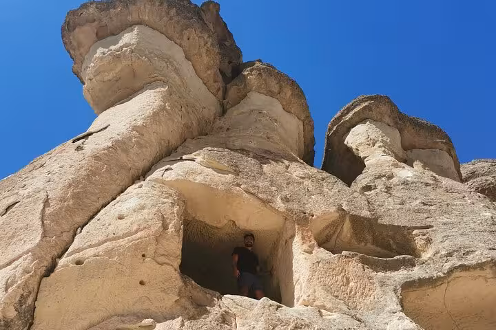 Cappadocia fairy chimney rock formations with cave entrance, highlight of a 3 days private Turkey tour