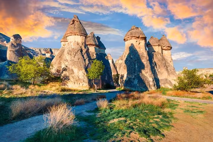 Fairy chimney rock formations in Cappadocia at sunset on 2-day 1-night tour from Istanbul by plane with balloon ride