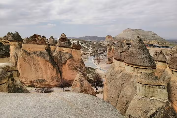 Panoramic view of Cappadocia fairy chimneys in Pasabag, scenic stop on Istanbul to Cappadocia cave hotel tour