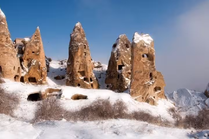 Snowy Cappadocia fairy chimneys and cave dwellings, scenic stop on 2-day tour from Istanbul by plane