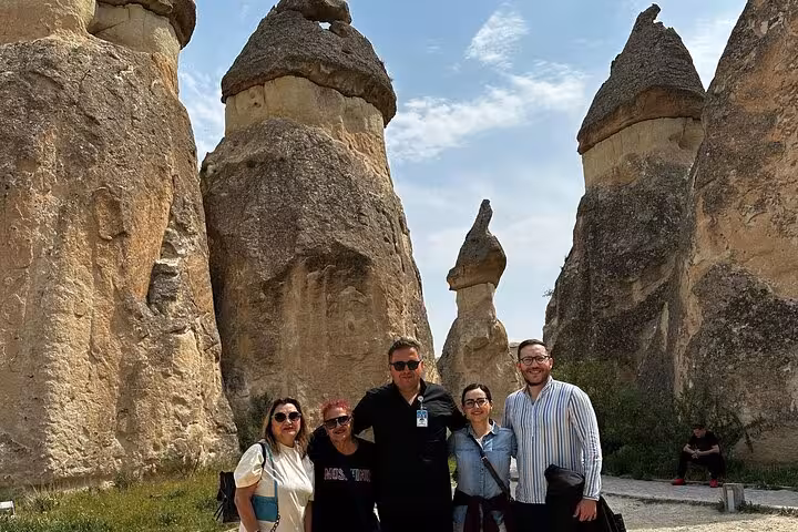 Small group photo at Cappadocia fairy chimneys in Pasabag on Full Day North Tour with local guide